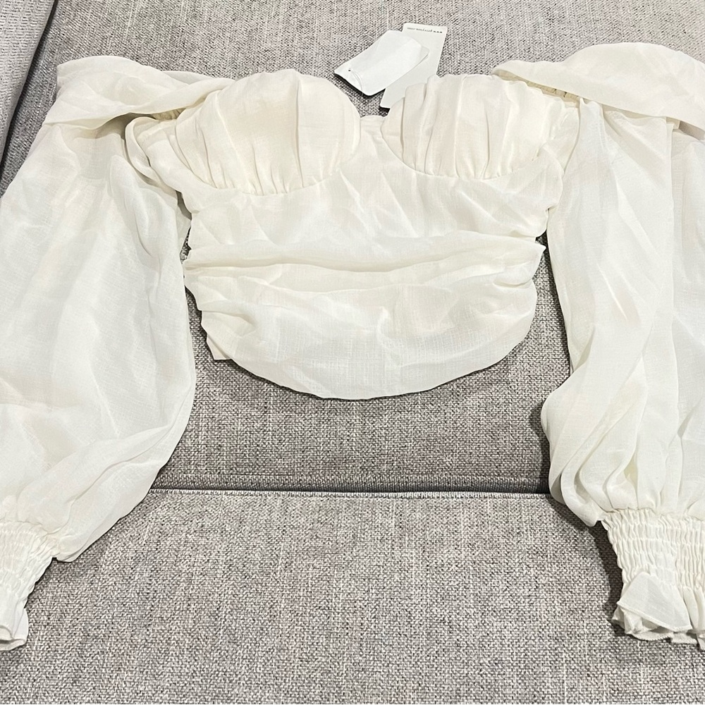 Cream colored, off the shoulder crop top